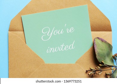 Invitation on color background, closeup
