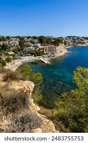 Invite your readers to experience the pristine beauty of Calpe Benissa in the province of Alicante, Spain. This stunning landscape view captures the vibrant seabed through crystal-clear waters, framed