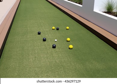 Inviting Bocce Ball Court With Artificial Turf On A Rooftop Terrace.