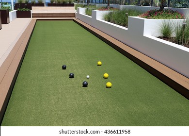 Inviting Bocce Ball Court With Artificial Turf On A Rooftop Terrace.