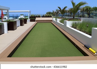 Inviting Bocce Ball Court With Artificial Turf On A Rooftop Terrace.