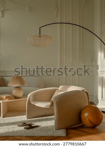 An inviting interior scene features a cozy armchair, decorative objects, and soft lighting, creating a tranquil and modern atmosphere for home design needs