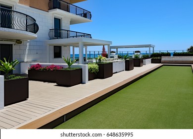 Inviting Rooftop Bocce Ball Court And Terrace At An Oceanfront Condo.