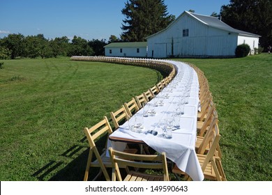 Inviting Table Setting For An Outdoor Dinner On The Farm