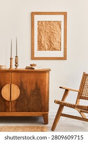 An inviting and warm interior features classic and modern wooden furniture, a framed art print, and decorative items. Perfect for home decor concepts