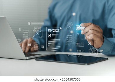 Invoice concept. Digital invoice processing and checklist financial workflow, electronic statements tax accounting solutions. Businessman using laptop to managing payment.