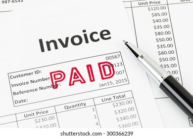 Invoice And Pen With Paid Stamp; Invoice Is Mock-up