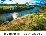 Inya river with grasses in summer. District of the city of Toguchin, Novosibirsk oblast, Western Siberia, Russia