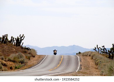 Inyokern, California, 04.08.2012
Motorcycle Riding In High Desert On Highway Through  Joshua Trees 