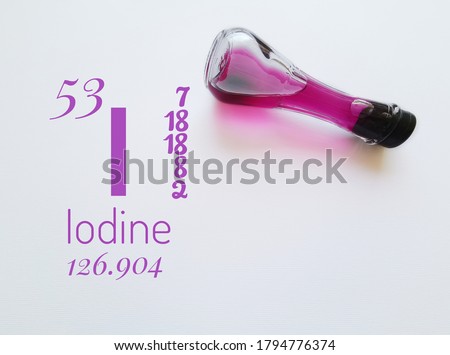 Iodine is a chemical element of the periodic table with the symbol I and atomic number 53. The symbol I with atomic data (mass, number, electron configuration) and a violet iodine solution in a flask.