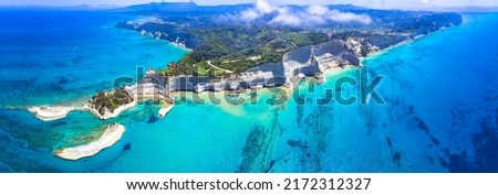 Ionian islands of Greece. Panoramic aerial view of stunning Cape Drastis - natural beuty landscape with white rocks and turquoise waters, northern part of Corfu island. 