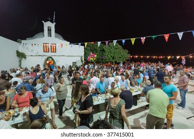Ios, Greece - September 7, 2015: People are eating and celebrating at the big yearly festival in the name of Holy Mary in Ios, Greece.