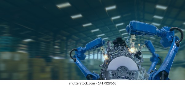 Iot Industry 4.0 Technology Concept.Smart Factory Using Trending Automation Robotic Arms With Part On Conveyor Belt In Operation Line. Automotive Manufacturing Use It For Precision, Repetition, Intens