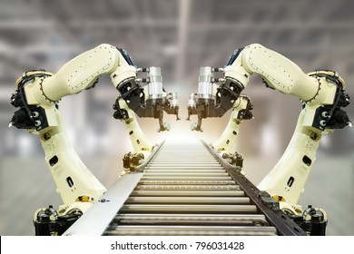 Iot Industry 4.0 Technology Concept.Smart Factory Using Trending Automation Robotic Arms With Part On Conveyor Belt In Operation Line. Automotive Manufacturing Use It For Precision, Repetition,intense