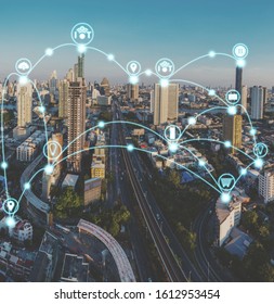IoT or internet of thing and smart city concept with day to night cityscape background.