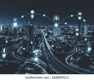 IoT or internet of thing and smart city concept with blue tone night cityscape background. - Shutterstock ID 1628694211