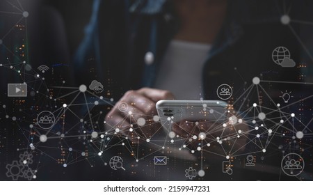 IoT Internet of Things, digital technology, global network connection, social media marketing concept. Woman using mobile smart phone and smart city with technology icons