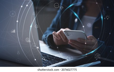 IoT, Internet of Things, online shopping, digital marketing, E-commerce, business and technology concept. Woman using mobile phone and laptop computer fro online shopping and banking via mobile app - Shutterstock ID 2076027775