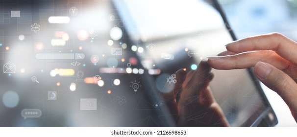 IoT Internet of Things, Social network, digital marketing, business and technology concept. Woman using digital tablet via mobile app with futuristic innovation icon, internet networking, digital tech