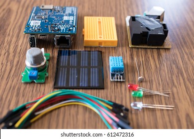 IoT Kit Components For Educational Science Experiment. Microcontroller, Dust Sensor, Gas Sensor, Solar Panel, Wires, Led, Humidity Sensor And Breadboard. DIY Weather Station For Cloud