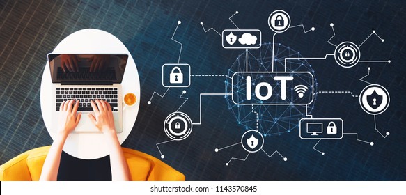 IoT Security Theme With Person Using A Laptop On A White Table