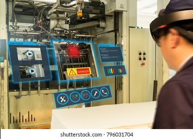 iot smart industry 4.0 concept. Industrial engineer(blurred) using smart glasses with augmented mixed virtual reality technology to read the data that  how to fix or maintenance the machine in factory