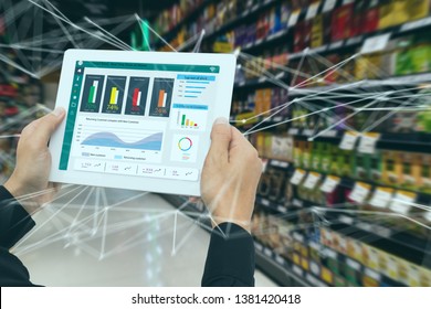 Iot Smart Retail In The Futuristic Concept, The Retailer Hold The Tablet And Use Augmented Reality Technology Monitor Data Of Out Of Shelve, Price, Planogram, Campaign Of Compliance In The Real Time