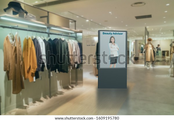 iot smart retail futuristic technology concept, smart\
Digital Signage display with virtual or augmented reality in the\
shop or retail advice to choose select ,buy cloths and give a\
rating of products 