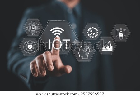 IoT Technology and Wireless Connectivity Concept. Internet of Things, Businessman touching on IoT interface with icons AI, global networking, industrial automation, smart home, cybersecurity solution