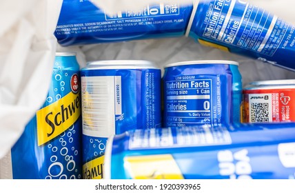 Iowa, USA - February 17, 2021: Schweppes Club Soda In The Blue Can. Carbonated Water With Zero Percent Calories For A Serving Size.