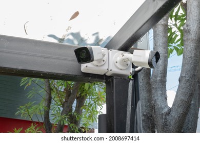 IP CCTV camera install by have water proof cover to protect camera with black steel poles and home security system concept.