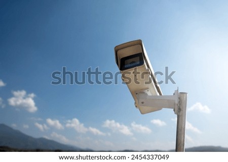ip cctv camera installed on high metal post of farmland to do security by monitoring on mobile phone and computer to save human life and to protect human property by cctv camera instead of human.
