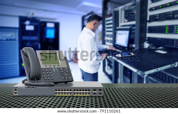 IP Telephone and\
Network switch 24 port gigabit and blur network administrator in\
data center room