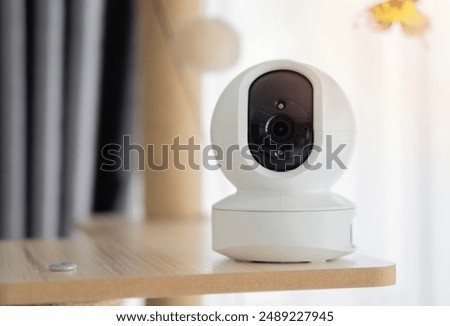 IP wireless CCTV camera indoor device control camera setting on cat tower at home. Security with pet concept. Selective focus.