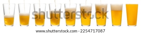 IPA or APA ale beer is pouring into shaker pint glass isolated on a white background