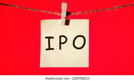 IPA Symbols, The Concept Of An Initial Public Offering Of Shares On Paper In Front Of A Red Background.