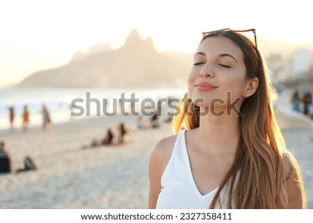 Ipanema Vibes. Girl on Ipanema beach at sunset, Rio de Janeiro, Brazil.