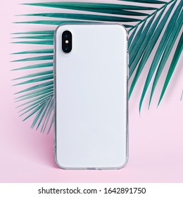 IPhone X In Clear Silicone Case Isolated On Pink Background Back View. Phone Case Mock Up