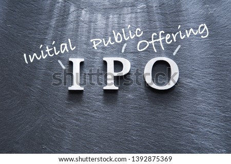 IPO abbreviation by wood letters on wood background, IPO is Initial Public Offering