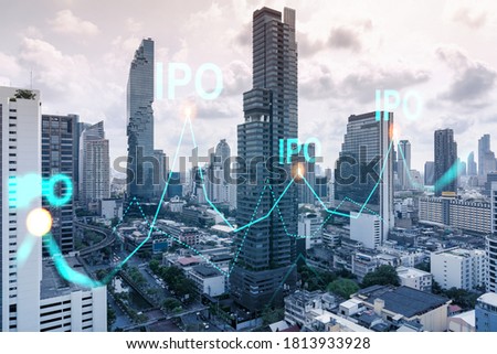 IPO icon hologram over panorama city view of Bangkok, the hub of initial public offering in Asia. The concept of exceeding business opportunities. Double exposure.