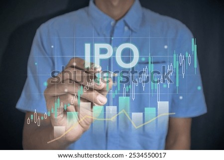 IPO or initial public offering concept. Man holding a pen with virtual stock graph.