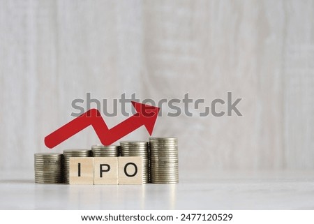 IPO ( Initial Public Offering), Red arrow on coins money and ipo word on wooden background, investment and business concept