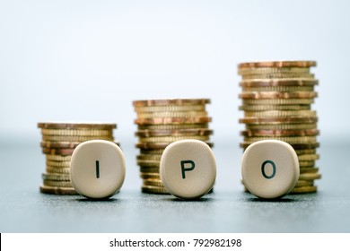IPO letter blocks  and stacked coins. IPO stands for Initial Public Offering.