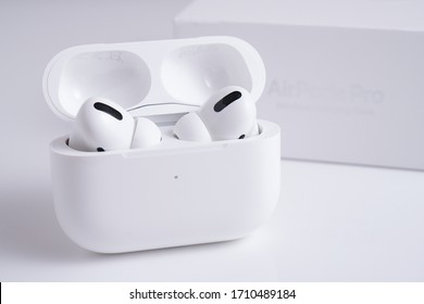 Ipoh, Perak, Malaysia, 20 April 2020 - Close up Apple Airpods Pro and iPhone isolated against white. The new airpods pro features active noise cancelling and transparency.