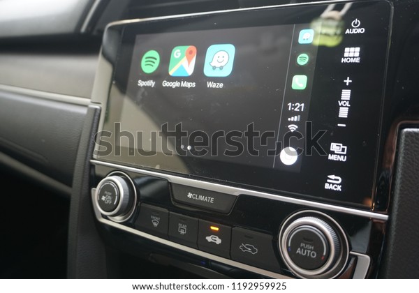 Ipoh, Perak, Malaysia, 29\
September 2018; Apple Carplay iOS 12 can support Spotify, Waze and\
Google Maps application on the car now. New technology for car\
system.