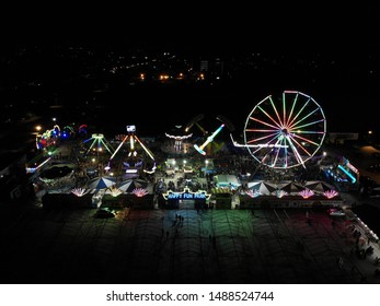 Ipoh, Perak, Malaysia, Circa July 2019 - Aerial View And Top Down Fun Park Including Carousel Merry Go Round At Night. Image Contain Certain Grain Or Noise And Soft Focus.