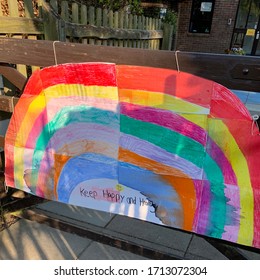 Ipswich, Suffolk, UK - 23 April 2020: Rainbow Of Hope On A Primary School Gate. The School Is Closed Due To The Coronavirus Lockdown.