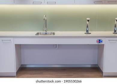 Ipswich, Suffolk, United Kingdom- January 28th 2021 : Shallow Depth Kitchen Sink With Wheelchair Access In Office Workplace, In Compliance With DDA Regulations.