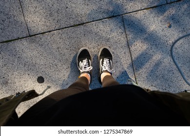 Ipswich, Suffolk, United Kingdom - September 28, 2018: Vans Old School Shoes, Pointing Down, Top View. Womans Legs, Copy Space - Illustrative Editorial