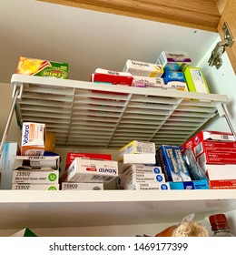 Ipswich,UK - 3 July 2019: Domestic Medicine Storage On A High Shelf Of A Kitchen Cupboard.